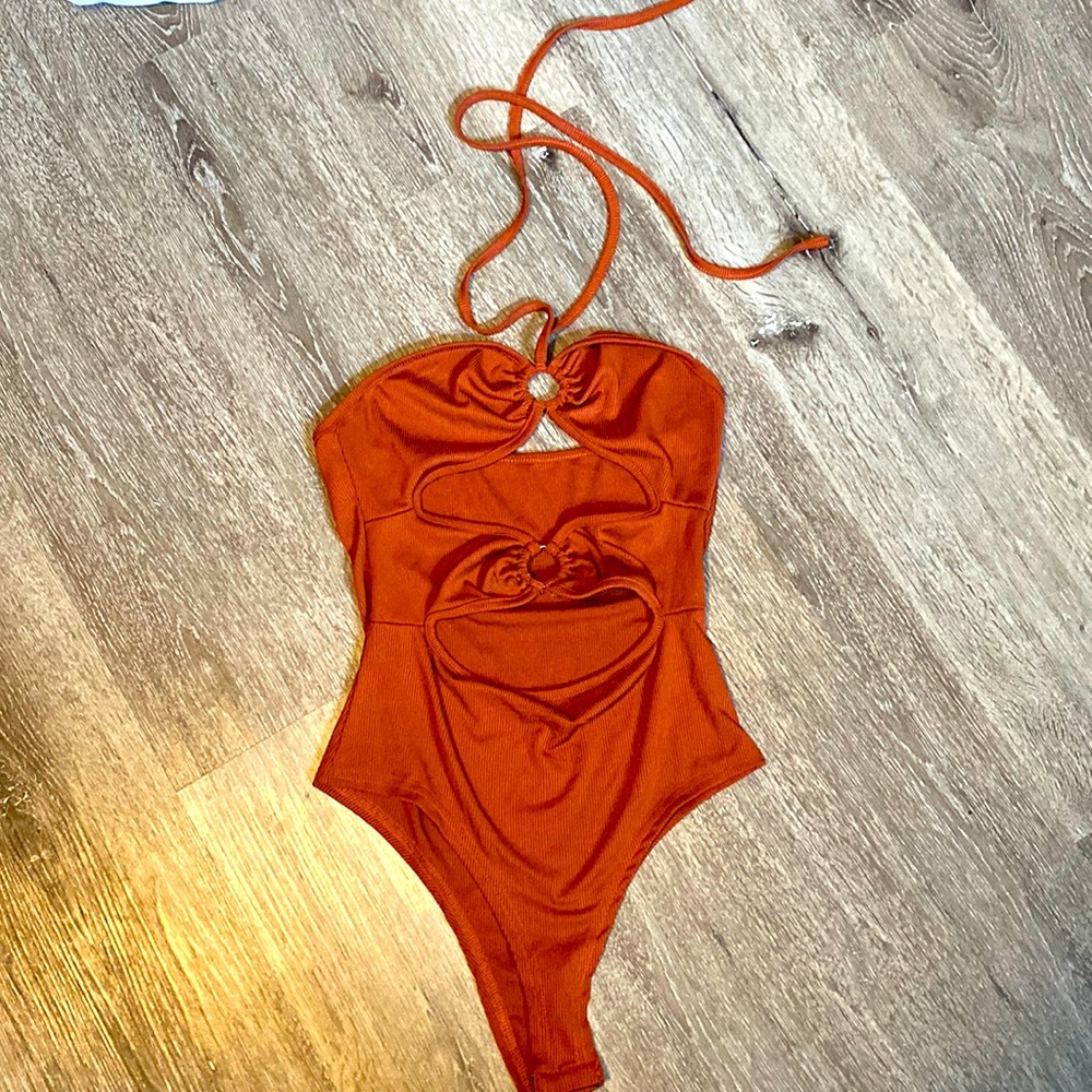 Body suit with mid section cut outs
